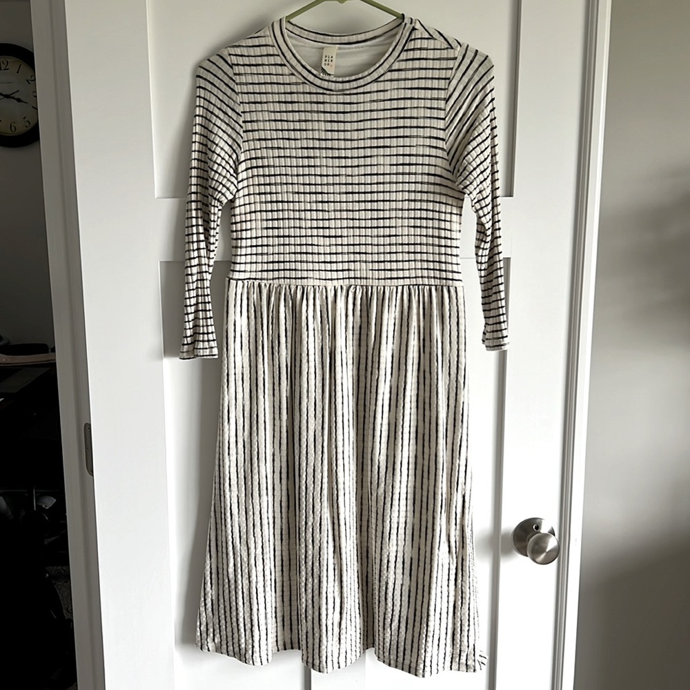 Navy blue and cream striped a line type maternity dress.